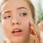 Woman touching her facial skin